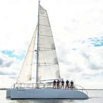 Miss Naples 48' catamaran with sails up